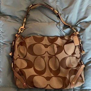 Tan monogrammed Coach purse